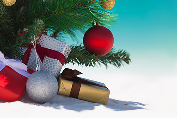 Image showing Summertime christmas tree on beach with presents