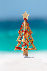 Image showing Christmas in the summer - Driftwood Christmas tree on beach