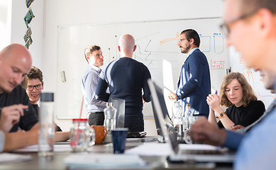 Image showing Relaxed informal IT business startup company team meeting.