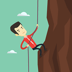 Image showing Business man climbing on the mountain.