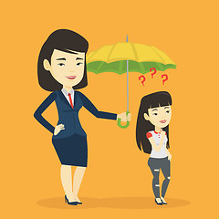 Image showing Businesswoman holding umbrella over woman.