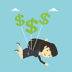 Image showing Business woman flying with dollar signs.