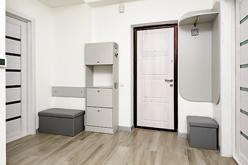 Image showing Apartment hallway with door and closet