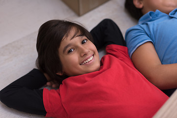 Image showing young boys having fun on the floor