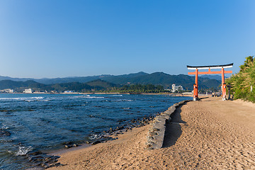 Image showing Red torii in Aoshima Shrine with blue sky
