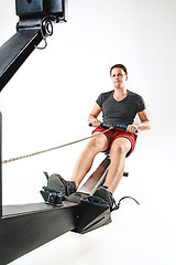 Image showing Man Using A Press Machine In A Fitness Club.