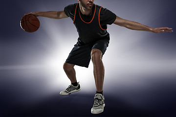 Image showing Full length portrait of a basketball player with ball