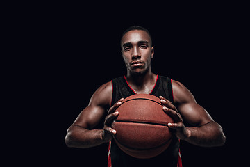 Image showing The portrait of a basketball player with ball