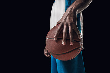 Image showing The portrait of a basketball player with ball