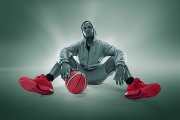 Image showing Full length portrait of a basketball player with ball