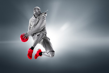 Image showing Full length portrait of a basketball player with ball