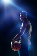 Image showing The portrait of a basketball player with ball