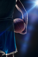 Image showing The portrait of a basketball player with ball