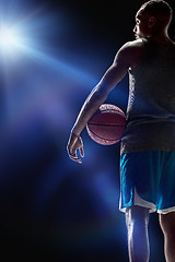 Image showing The portrait of a basketball player with ball