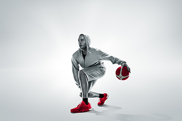 Image showing Full length portrait of a basketball player with ball