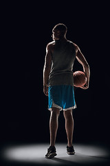 Image showing The portrait of a basketball player with ball