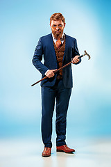 Image showing The barded man in a suit holding cane.