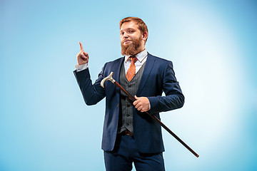 Image showing The barded man in a suit holding cane.