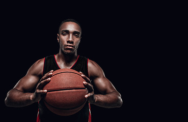 Image showing The portrait of a basketball player with ball