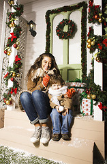 Image showing happy smiling family on Christmas at house with gifts, young mot