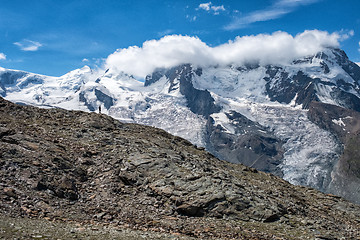 Image showing Silhouette of a standing  man on the mountain 