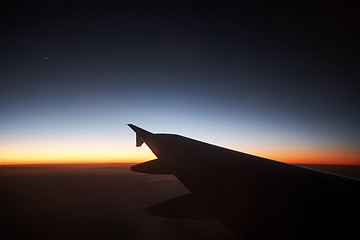 Image showing Seeing the sunset on flight