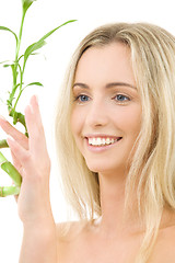 Image showing happy blonde with bamboo