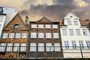 Image showing Dramatically sunset clouds above the buildings