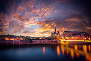 Image showing Notre Dame Cathedral with Paris cityscape at dus