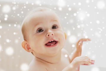 Image showing face of happy little baby boy or girl looking up