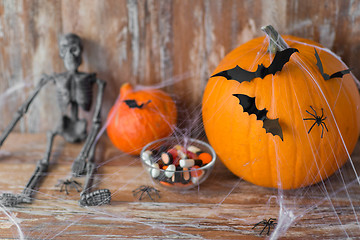 Image showing halloween pumpkins, skeleton and candies
