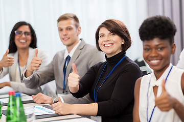 Image showing people at business conference showing thumbs up