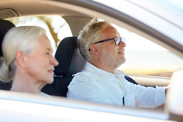 Image showing happy senior couple driving in car