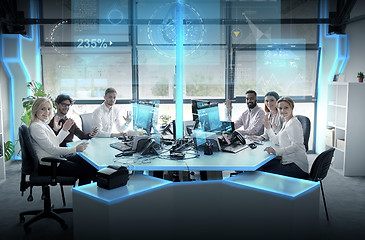 Image showing business team at office with virtual screens