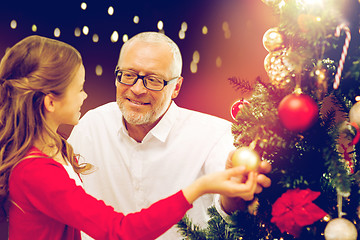 Image showing happy family decorating christmas tree