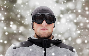 Image showing sports man with ski goggles in winter outdoors