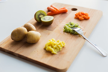 Image showing mashed fruits and vegetables with forks on board