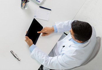 Image showing doctor with tablet pc and prescription at clinic