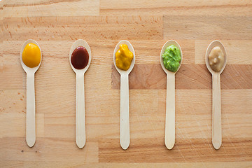 Image showing vegetable or fruit puree or baby food in spoons