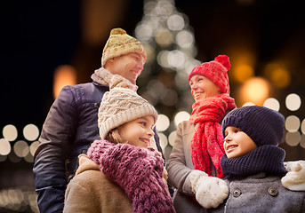 Image showing happy family outdoors at christmas eve