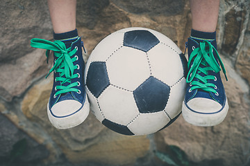 Image showing Young little boy sitting  with soccer ball.