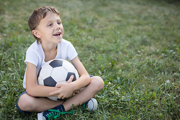 Image showing Portrait of a young  boy with soccer ball.