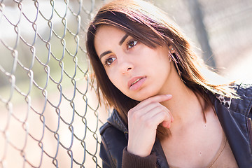 Image showing Beautiful Meloncholy Mixed Race Young Woman Portrait Outside.