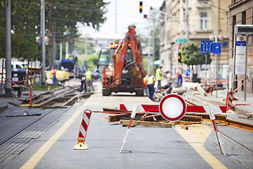 Image showing Workers repair the tram line in the city