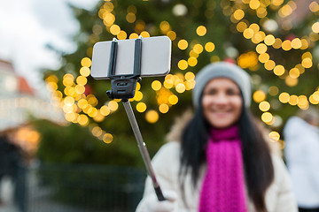 Image showing woman taking selfie with smartphone at christmas 
