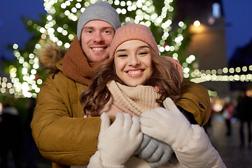 Image showing happy couple hugging at christmas tree