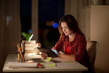 Image showing student girl or woman with tablet pc at night home