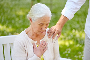 Image showing senior woman feeling sick at summer park