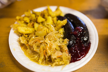 Image showing braised cabbage and sausages with sauce on plate