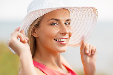 Image showing portrait of beautiful smiling woman in sun hat